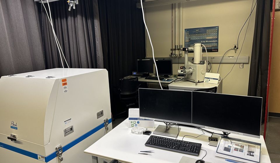 Material testing technician using machine