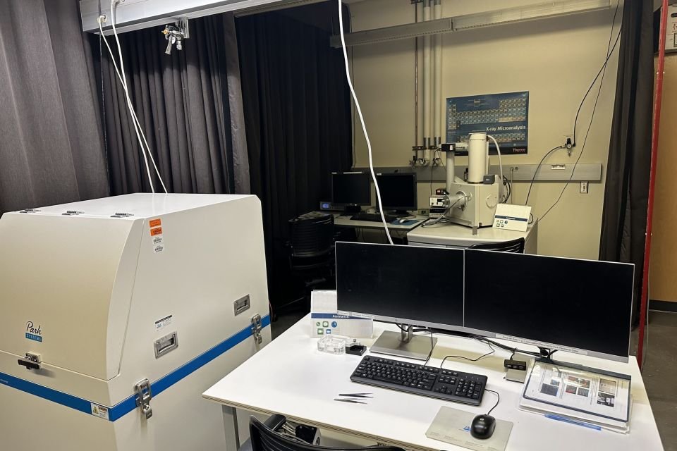 Material testing technician using machine