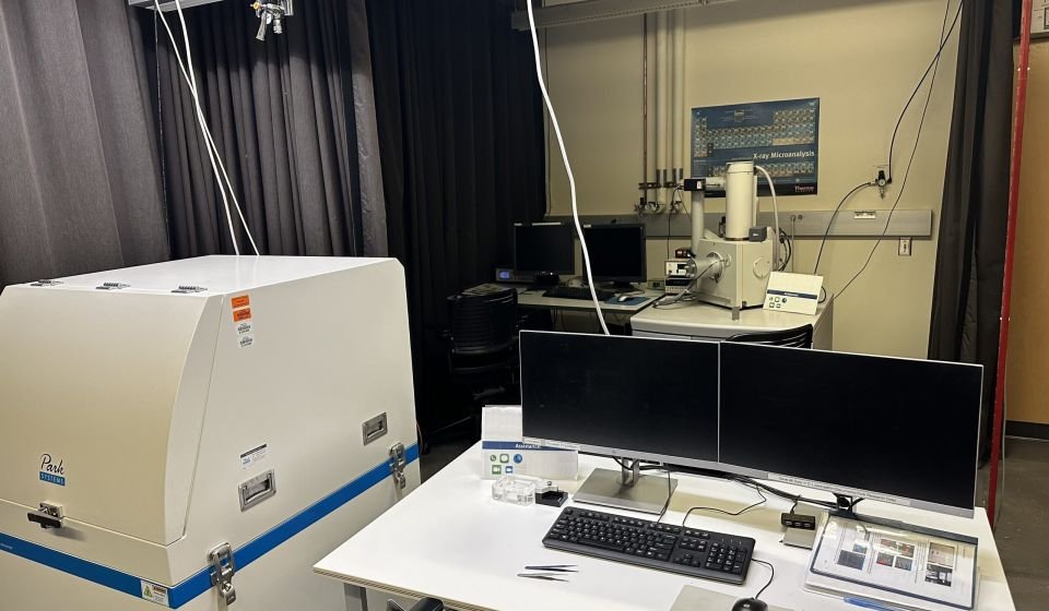 Material testing technician using machine